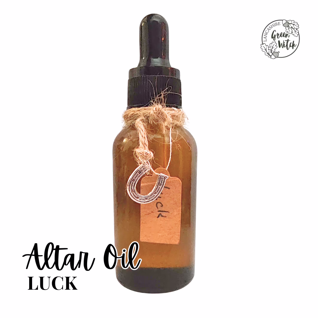 Luck Altar Oil with horseshoe charm, peppermint, lemon, and bergamot in a 30ml amber dropper bottle